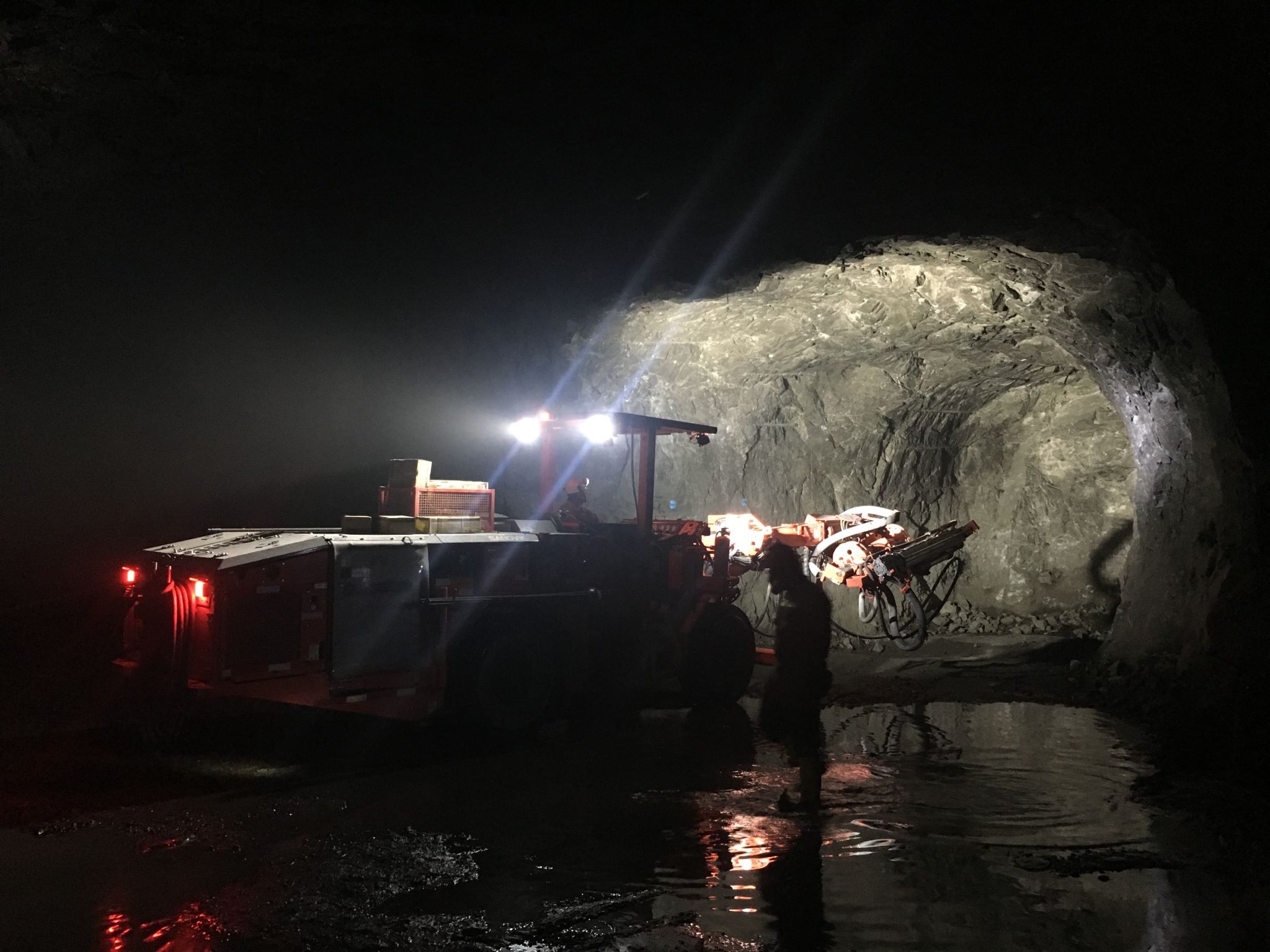 Premium Photo  Miners working deep inside a coal mine facility generative  ai