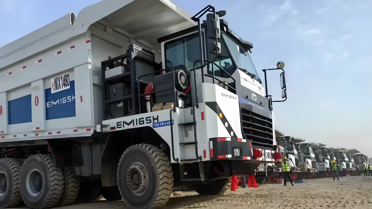 Iridium Molybdenum delivers fleet of 115 t hybrid wide body trucks - International Mining